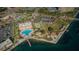 Aerial view of the property showcasing the pool, waterways, tennis courts, and more at 4900 Brittany S Dr # 502, St Petersburg, FL 33715