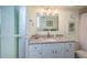 Bathroom featuring white vanity with granite countertop and decorative accents at 4900 Brittany S Dr # 502, St Petersburg, FL 33715
