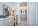 Bright office space with a desk and a glimpse into an adjacent, beautifully lit bathroom at 4900 Brittany S Dr # 502, St Petersburg, FL 33715