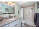 Traditional bathroom with granite countertops, shower and tub with shower curtain, and neutral paint at 4900 Brittany S Dr # 502, St Petersburg, FL 33715