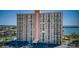 The exterior of the high rise building with parking and waterfront views at 4900 Brittany S Dr # 502, St Petersburg, FL 33715