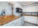 Efficient kitchen has granite counters, white cabinetry, and stainless appliances at 4900 Brittany S Dr # 502, St Petersburg, FL 33715