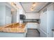 Efficient kitchen has granite counters, white cabinetry, and stainless appliances at 4900 Brittany S Dr # 502, St Petersburg, FL 33715