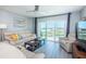 Inviting living room boasts a balcony with water views and comfortable seating at 4900 Brittany S Dr # 502, St Petersburg, FL 33715