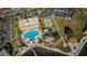 Aerial view of community pool and amenities featuring lounge chairs, recreation areas, and beautiful landscaping at 4900 Brittany S Dr # 502, St Petersburg, FL 33715