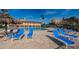 Inviting pool deck features comfortable lounge chairs for relaxation with ample seating and a tropical vibe at 4900 Brittany S Dr # 502, St Petersburg, FL 33715