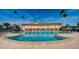 Stunning community pool offering a refreshing oasis with expansive deck, providing a great outdoor experience at 4900 Brittany S Dr # 502, St Petersburg, FL 33715