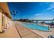 Beautiful pool view from the condo balcony, featuring white seating and waterfront access at 4900 Brittany S Dr # 502, St Petersburg, FL 33715