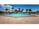 Large rectangular swimming pool with brick surround and plenty of lounge chairs at 4900 Brittany S Dr # 502, St Petersburg, FL 33715