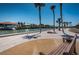 View of the waterfront with lush landscaping, docks, and a bench at 4900 Brittany S Dr # 502, St Petersburg, FL 33715