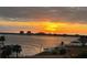 Breathtaking sunset over the bay, complete with palm trees and waterfront views at 4900 Brittany S Dr # 502, St Petersburg, FL 33715