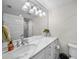 Elegant bathroom with white marble countertop, modern fixtures, and a glass-enclosed shower at 5018 S The Riviera St, Tampa, FL 33609