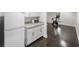 The kitchenette has white cabinets, a granite countertop, a microwave, and a full-size refrigerator at 5018 S The Riviera St, Tampa, FL 33609