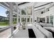 Bright living area with floor-to-ceiling windows, modern furnishings, and an abundance of natural light at 5018 S The Riviera St, Tampa, FL 33609