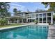 Stunning backyard oasis with a large swimming pool, covered patio, and ample space for entertaining at 5018 S The Riviera St, Tampa, FL 33609