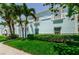 Charming blue condo building with lush green landscaping, creating a welcoming atmosphere at 5094 Starfish Se Dr # E, St Petersburg, FL 33705