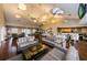 Spacious clubhouse with billiards table, comfortable seating, and modern lighting fixtures at 5094 Starfish Se Dr # E, St Petersburg, FL 33705