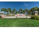 Waterside community entrance sign surrounded by lush landscaping and palm trees against a clear blue sky at 5094 Starfish Se Dr # E, St Petersburg, FL 33705