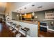 Charming kitchen area featuring sleek countertops, modern appliances, pendant lighting and bar stool seating at 5094 Starfish Se Dr # E, St Petersburg, FL 33705
