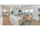 Inviting living room with a ceiling fan, open floor plan, access to a deck, and modern decor at 5094 Starfish Se Dr # E, St Petersburg, FL 33705