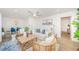 Bright living room with a ceiling fan, comfortable seating, and stylish decor, creating an inviting atmosphere at 5094 Starfish Se Dr # E, St Petersburg, FL 33705