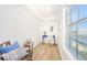 Bright office space featuring a vanity, chair, and beautiful water views from the adjacent window at 5094 Starfish Se Dr # E, St Petersburg, FL 33705