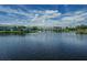 Scenic pond with a beautiful fountain surrounded by lush landscaping and well-maintained buildings at 5094 Starfish Se Dr # E, St Petersburg, FL 33705