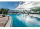 Large community pool with sun-kissed water and plenty of poolside seating at 5094 Starfish Se Dr # E, St Petersburg, FL 33705