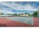 Well-maintained tennis courts surrounded by lush greenery and palm trees at 5094 Starfish Se Dr # E, St Petersburg, FL 33705