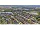 Gorgeous aerial view of a neighborhood highlighting the many homes, landscaping, and water features at 5108 Suncatcher Dr, Wesley Chapel, FL 33545