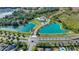 Aerial view showcasing the community pool, ponds, and manicured landscaping at 5108 Suncatcher Dr, Wesley Chapel, FL 33545