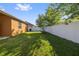 The private fenced back yard with grass is perfect for outdoor activities at 5108 Suncatcher Dr, Wesley Chapel, FL 33545