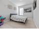 Minimalist bedroom featuring light hardwood floors and a modern design at 5108 Suncatcher Dr, Wesley Chapel, FL 33545