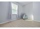 Bright bedroom with a cozy reading nook near a window at 5108 Suncatcher Dr, Wesley Chapel, FL 33545