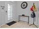 A stylish entryway showcases tiled floors and features a decorative glass door and modern accents at 5108 Suncatcher Dr, Wesley Chapel, FL 33545