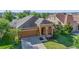 Exterior of the home features a well manicured lawn and covered entry at 5108 Suncatcher Dr, Wesley Chapel, FL 33545