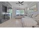 Comfortable living room featuring a large sectional, modern fireplace, and sliding glass doors to the outdoors at 5108 Suncatcher Dr, Wesley Chapel, FL 33545