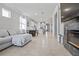 Bright open floor plan with tile floors, living room, dining area, and kitchen at 5108 Suncatcher Dr, Wesley Chapel, FL 33545