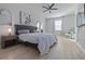 Spacious main bedroom featuring a ceiling fan and light hardwood flooring at 5108 Suncatcher Dr, Wesley Chapel, FL 33545