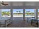 Outdoor patio featuring comfortable seating arrangements with an expansive view of the community pool at 5108 Suncatcher Dr, Wesley Chapel, FL 33545
