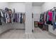 Spacious walk-in closet with ample hanging space on either side at 5108 Suncatcher Dr, Wesley Chapel, FL 33545