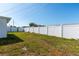 Backyard features a privacy fence and a green lawn at 5203 Overton Dr, New Port Richey, FL 34652