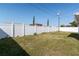 Backyard featuring a well-maintained lawn and a privacy fence at 5203 Overton Dr, New Port Richey, FL 34652