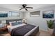 Staged bedroom with tile flooring, queen bed and modern decor at 5203 Overton Dr, New Port Richey, FL 34652