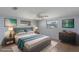 Stylishly staged bedroom with tile flooring and a comfortable queen size bed at 5203 Overton Dr, New Port Richey, FL 34652