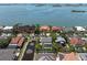 Aerial view of a waterfront community with multi-million dollar homes and gorgeous landscaping at 6113 Kipps Colony W Dr, Gulfport, FL 33707