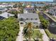 Beautiful home featuring a front yard with landscaping and a two-story outdoor balcony at 6113 Kipps Colony W Dr, Gulfport, FL 33707