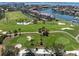 Picture-perfect view of a golf course surrounded by luxury homes and tranquil waterways at 6113 Kipps Colony W Dr, Gulfport, FL 33707