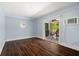 Cozy living room with hardwood floors and sliding glass doors to the patio at 6113 Kipps Colony W Dr, Gulfport, FL 33707
