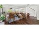 Inviting living room featuring hardwood floors, a plush leather sectional, and an open layout at 6113 Kipps Colony W Dr, Gulfport, FL 33707